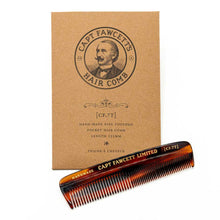 Captain Fawcett's hair comb with packaging on a white background